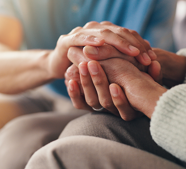 Hands offering comfort and support